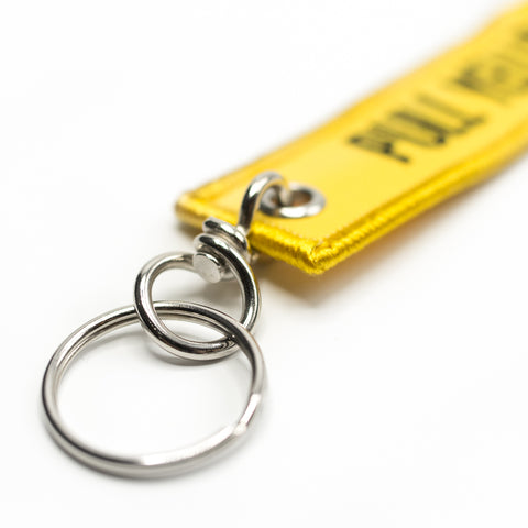 Pull The Yellow Strap Keychain | Ring Detail